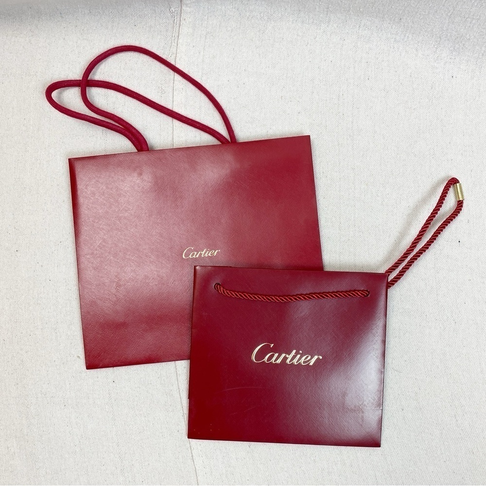 Pair Cartier shopping bags